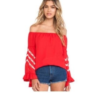 Joy Han red off the shoulder top